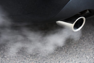 Car exhaust pipe with visible fumes