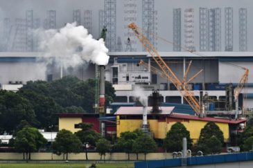 Photo: A factory emitting fumes from its chimney in Tuas on Dec 11, 2018.ST PHOTO: LIM YAOHUI