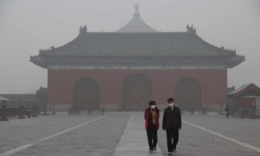 Image: Tourists at the Temple of Heaven in heavy smog in November 2018. Beijing has made great strides but still has a long way to go to comply with WHO guidelines. Photograph: Imaginechina/Rex/Shutterstock
