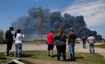 People in Deer Park, Tex., watching firefighters battle a petrochemical blaze on Tuesday. The city ordered residents to shelter in place on Thursday, the second time it had issued such a directive.CreditCreditGodofredo A. Vasquez/Houston Chronicle, via Associated Press